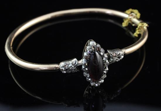 A Victorian gold, garnet and diamond hinged bangle,